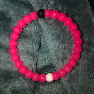 Hot pink Lokai bracelet Breast Cancer Awareness.